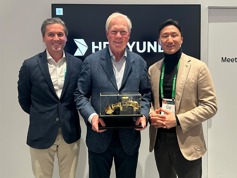Kisun Chung, Vice Chairman of HD Hyundai, Gifts A Golden Loader Award to NED High Executives For the length of CES Repeat in Las Vegas