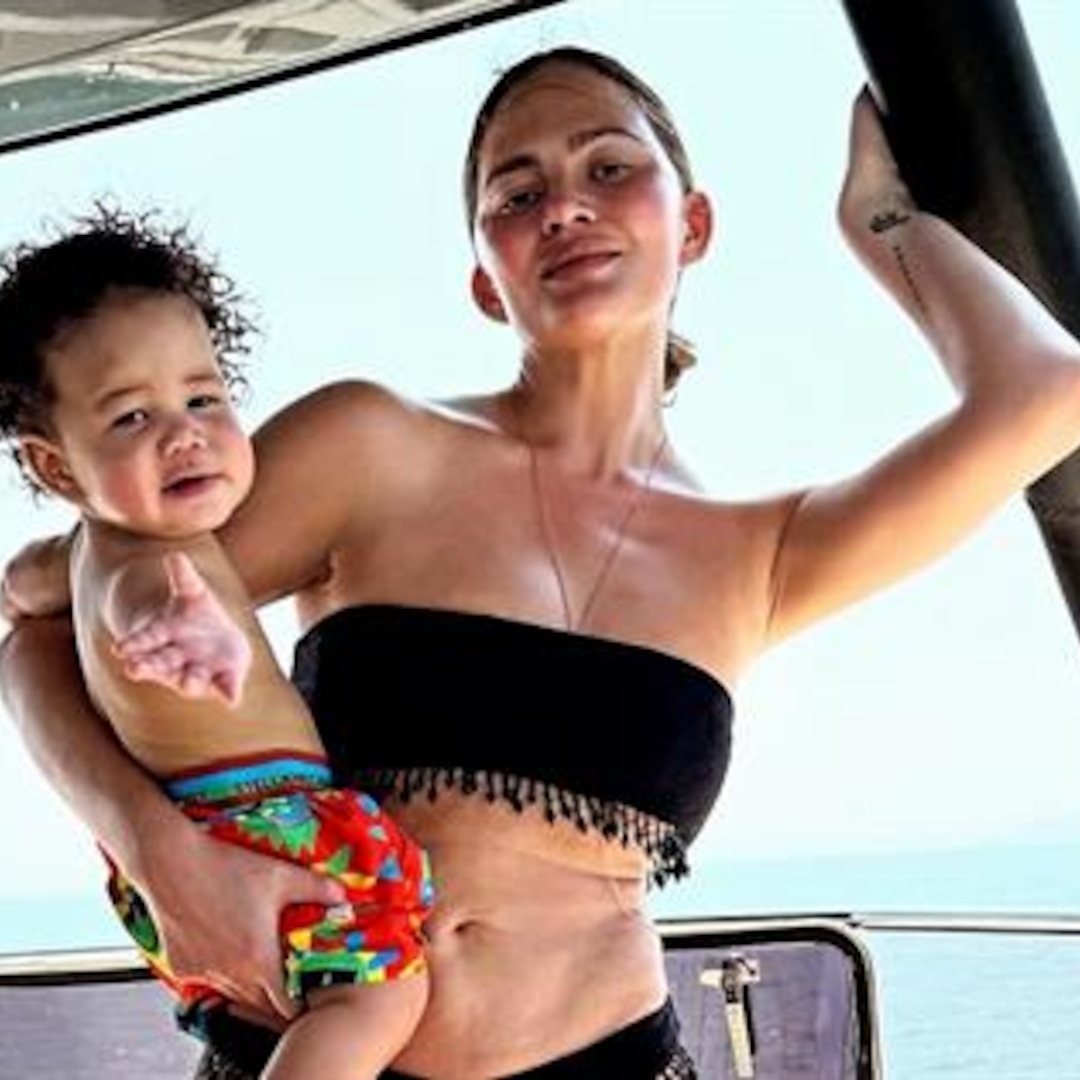 Chrissy Teigen Rocks Tremendous Shadowy Bikini in Cute with Son Wren on Thailand Commute